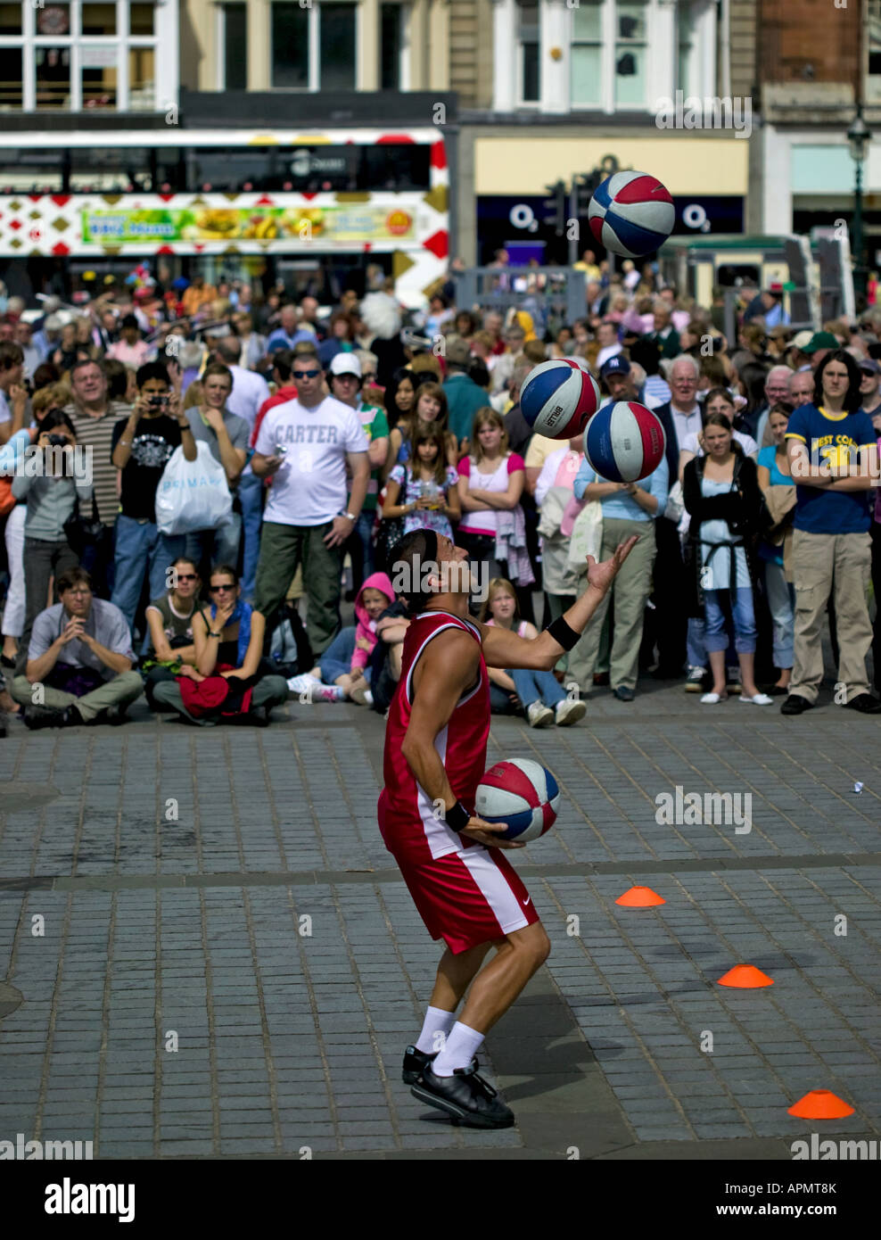 Street performer juggling basketballs at the Mound, Edinburgh Fringe Festival Scotland Stock Photo