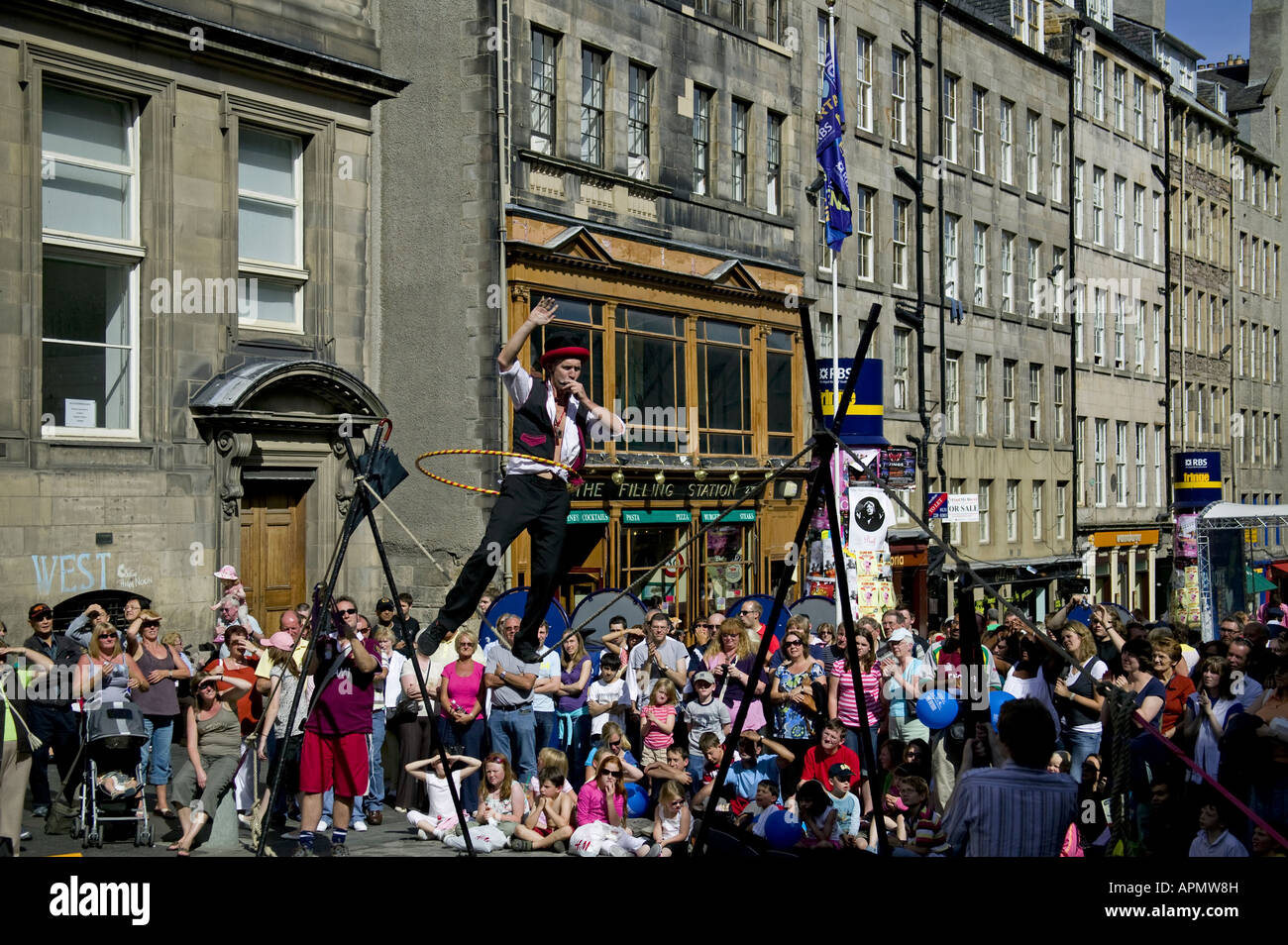 Edinburgh Fringe street performer walking slack rope, Scotland UK Europe Stock Photo