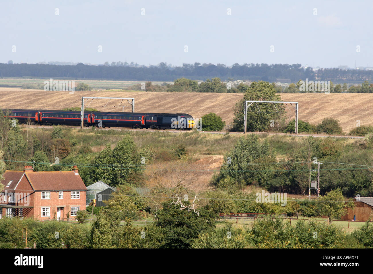 GNER Express Passenger Train heads south along the East Coast Main Line past Woodwalton Cambridgeshire Stock Photo