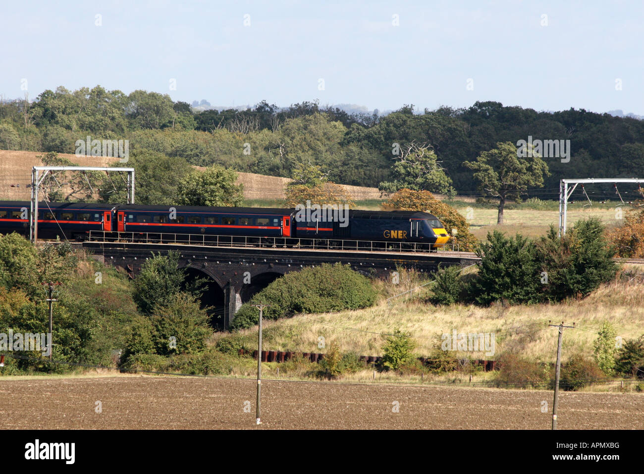GNER Express Passenger Train heads south along the East Coast Main Line past Woodwalton Cambridgeshire Stock Photo
