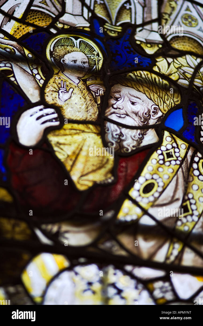 Stained glass detail of John the Baptist, St. Leonards Church, Bledington, Gloucestershire, UK Stock Photo