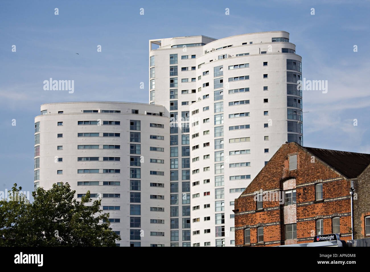Old and new buildings with the Altolusso apartments in the background Cardiff Wales UK Stock
