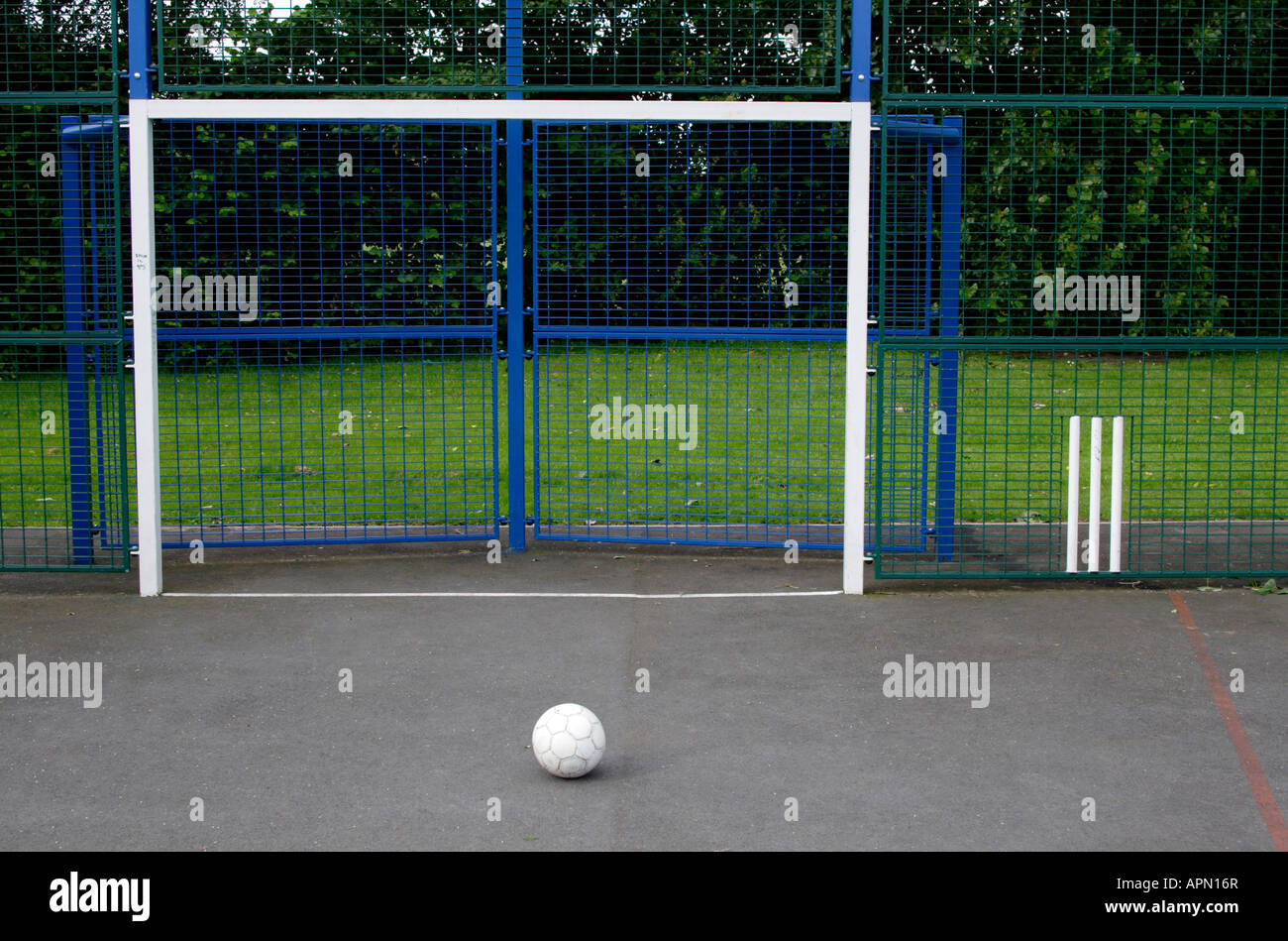 Football in front of open goal on concrete court Stock Photo Alamy
