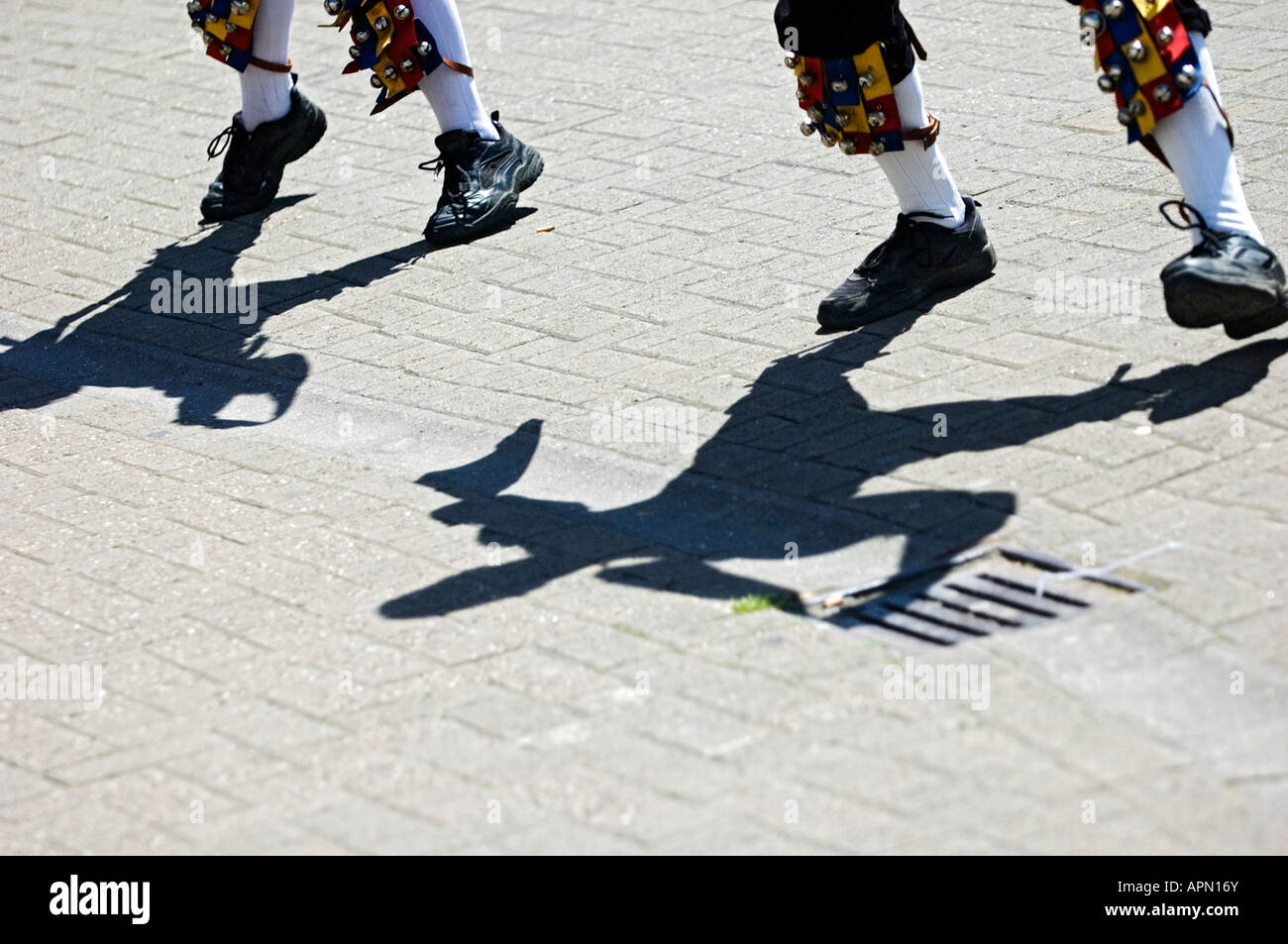 Shadows formed by Morris dancers performing a traditional handkerchief dance Stock Photo