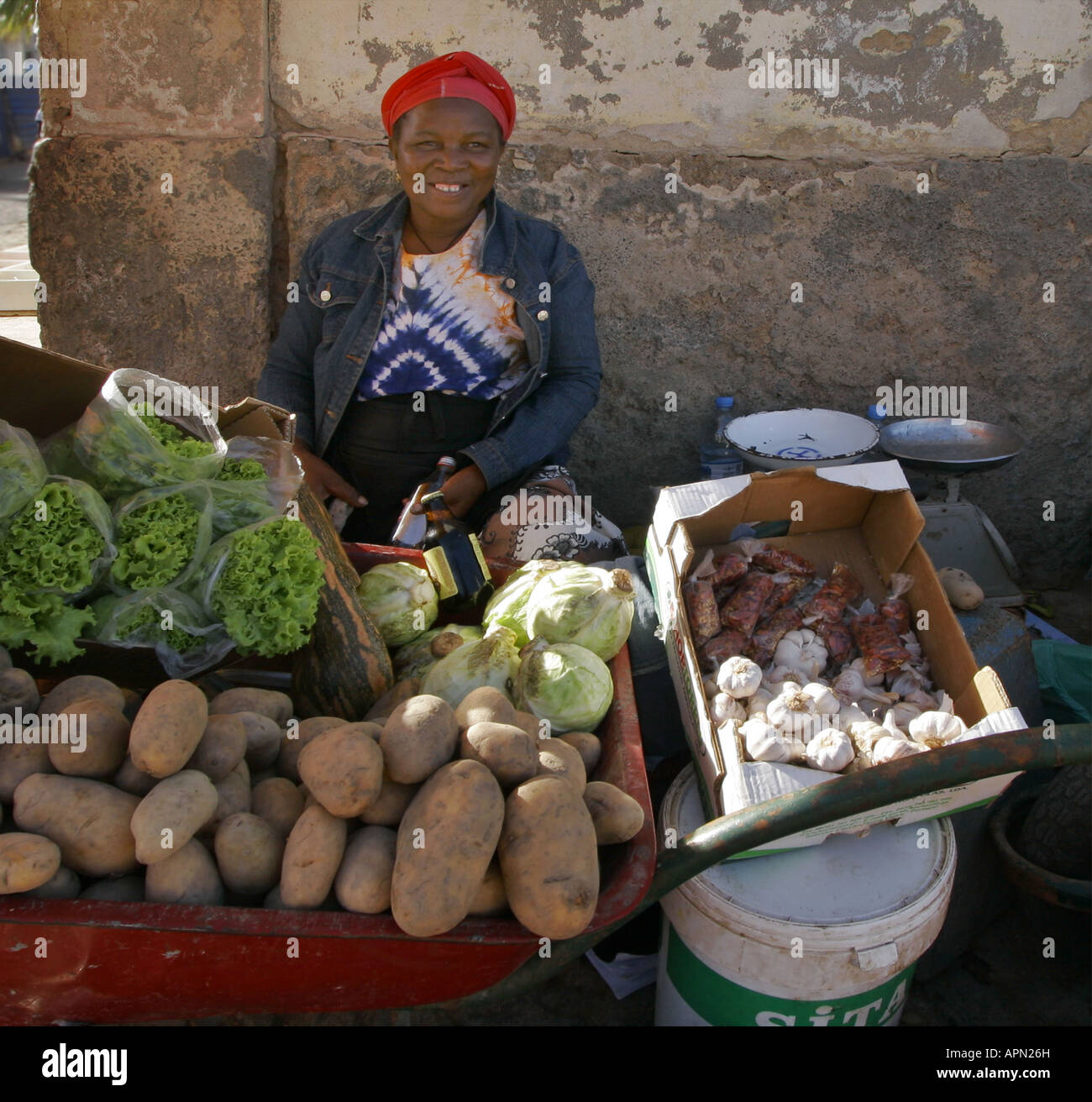 Smiling woman selling vegetables in a Cape Verde street Stock Photo - Alamy