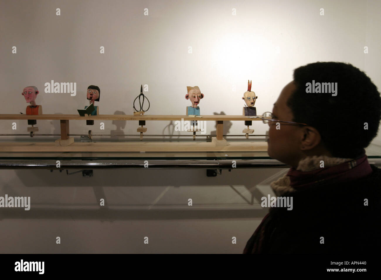 Woman visiting the Interactive Cabaret mechanical machine at exhibition oxo gallery London Stock Photo