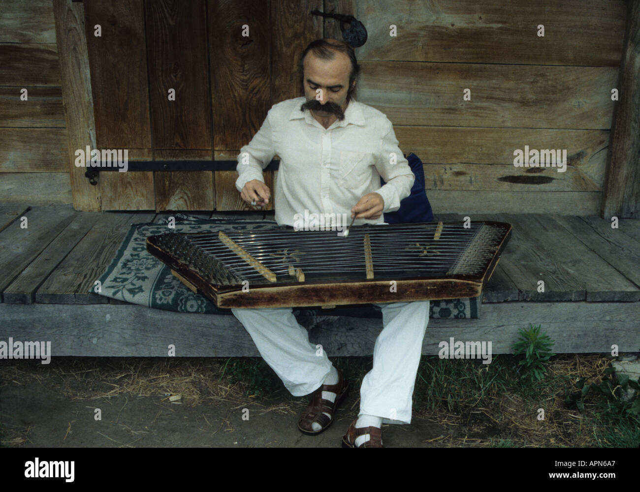 Dulcimer zither like instrument and player in Kiev Ukraine Stock Photo