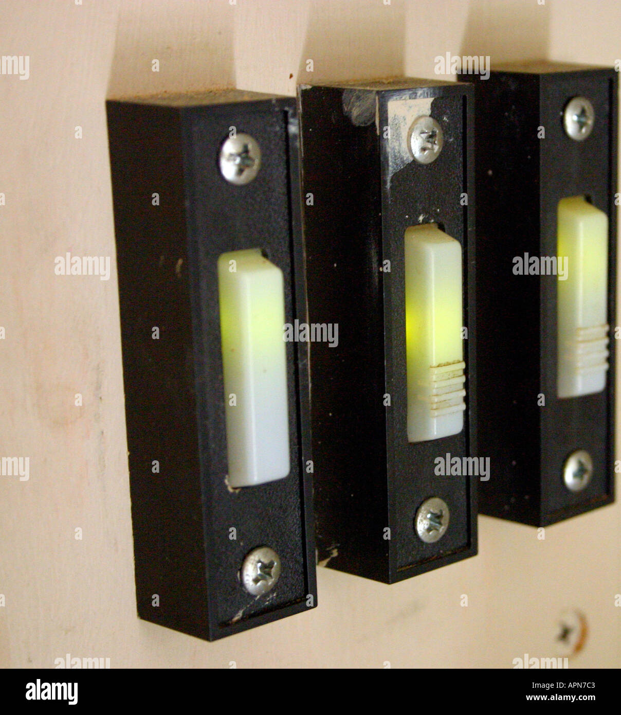 3 door bells that operate a garage doors Stock Photo Alamy