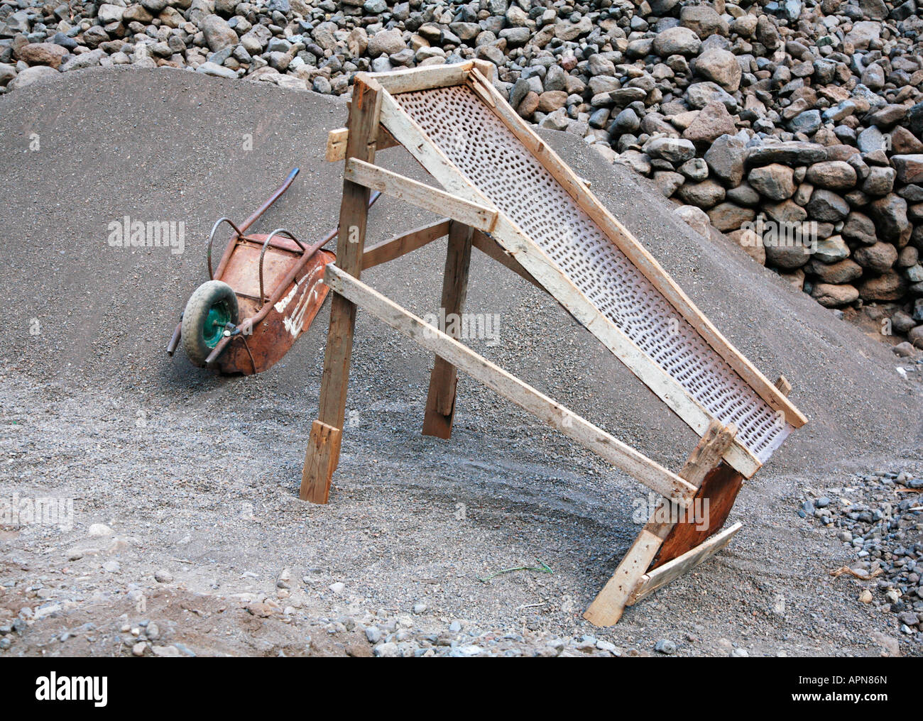 Primitive framed riddle used to grade hard volcanic rocks into fine ...