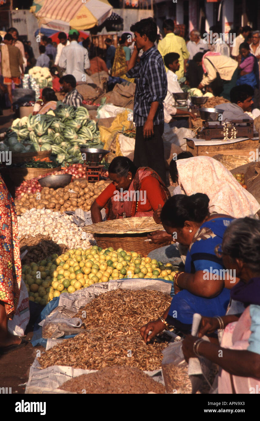GOA, INDIA. Women selling fruit, vegetables and spices at Mapusa market. Stock Photo