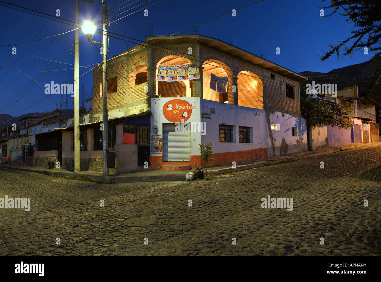 brick building street light and cobblestone street in Ajijic Mexico