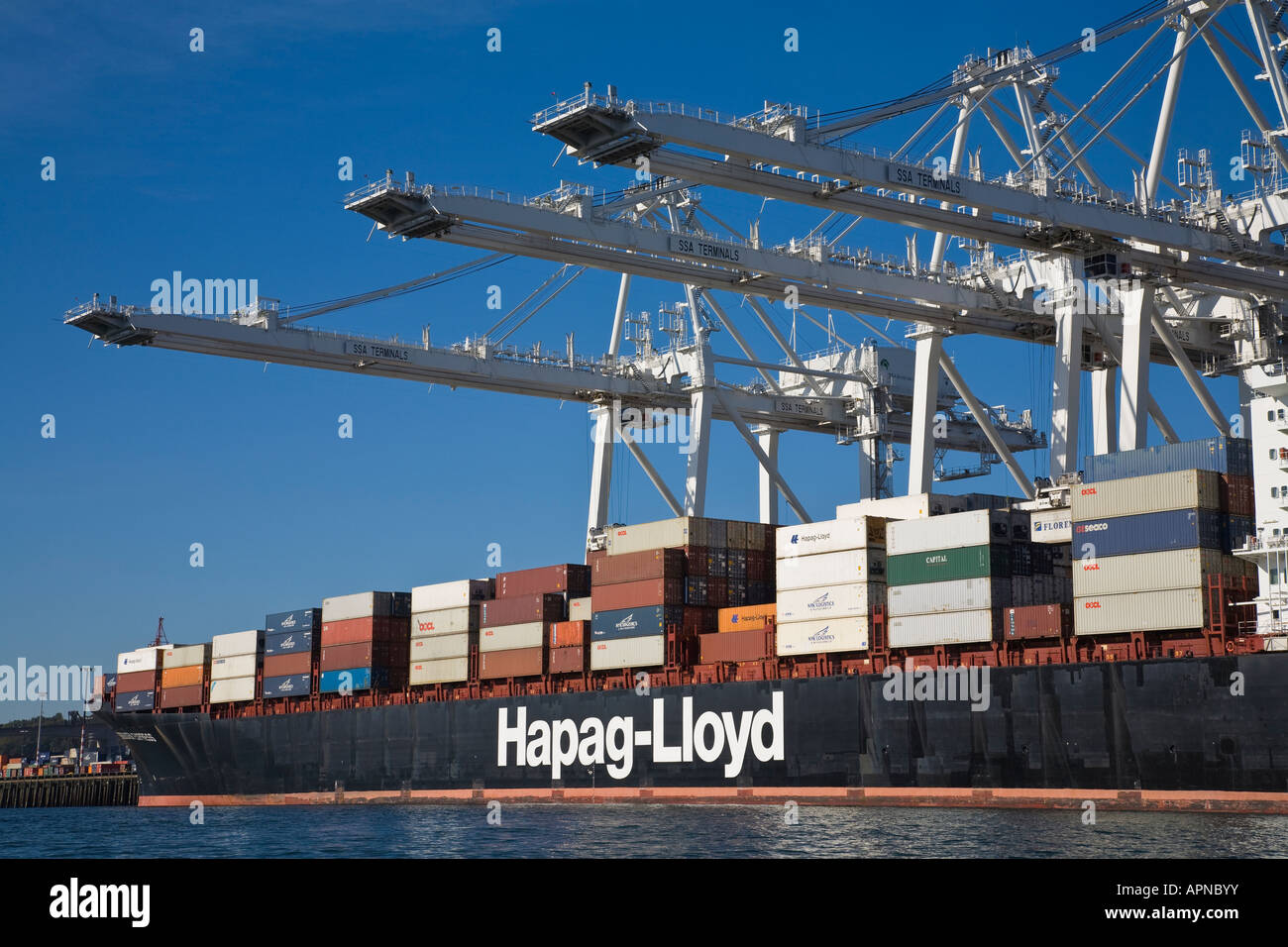 Cranes and dock at port of Seattle with container ship Stock Photo - Alamy