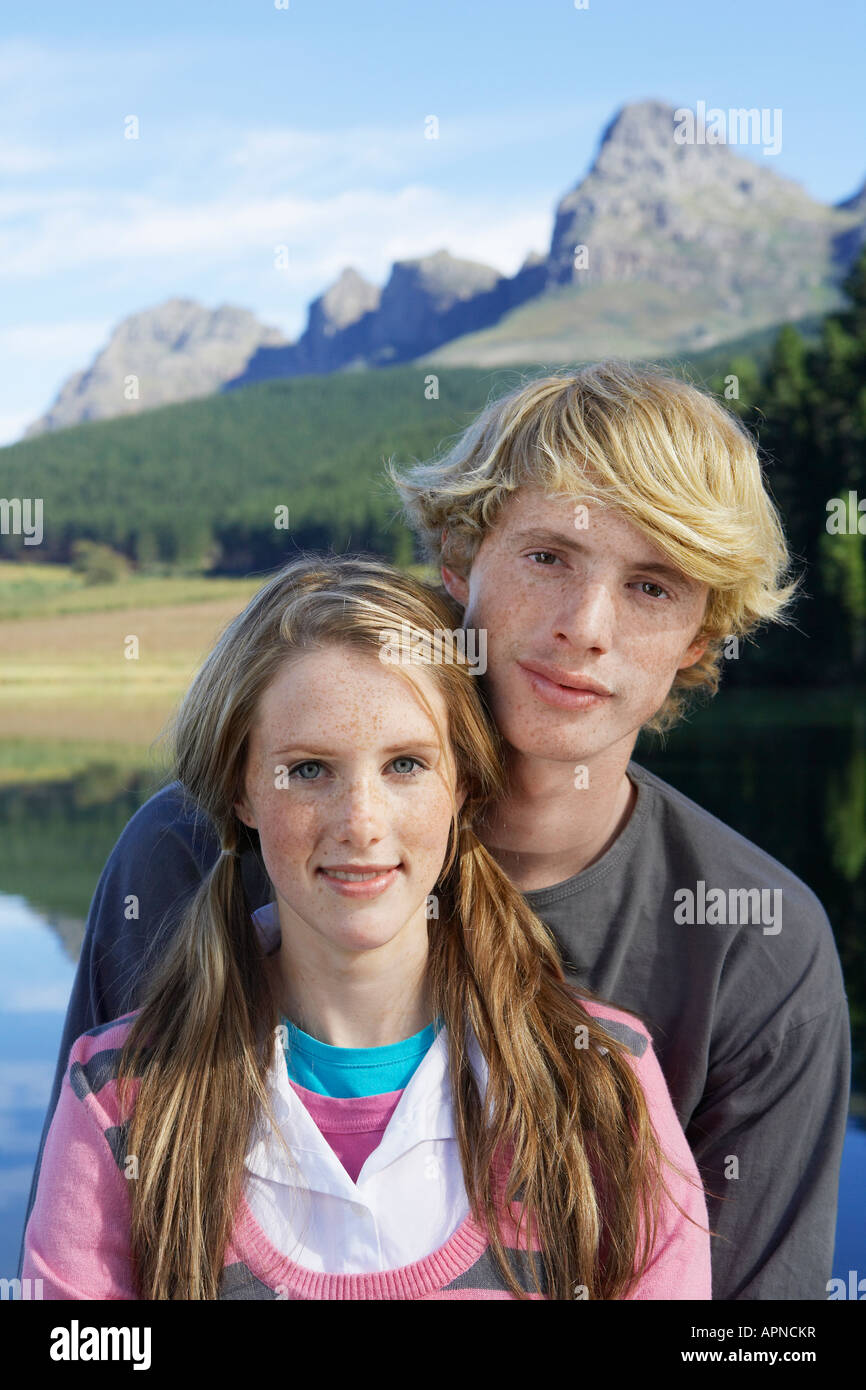 Teenage couple at lakeside (portrait) Stock Photo