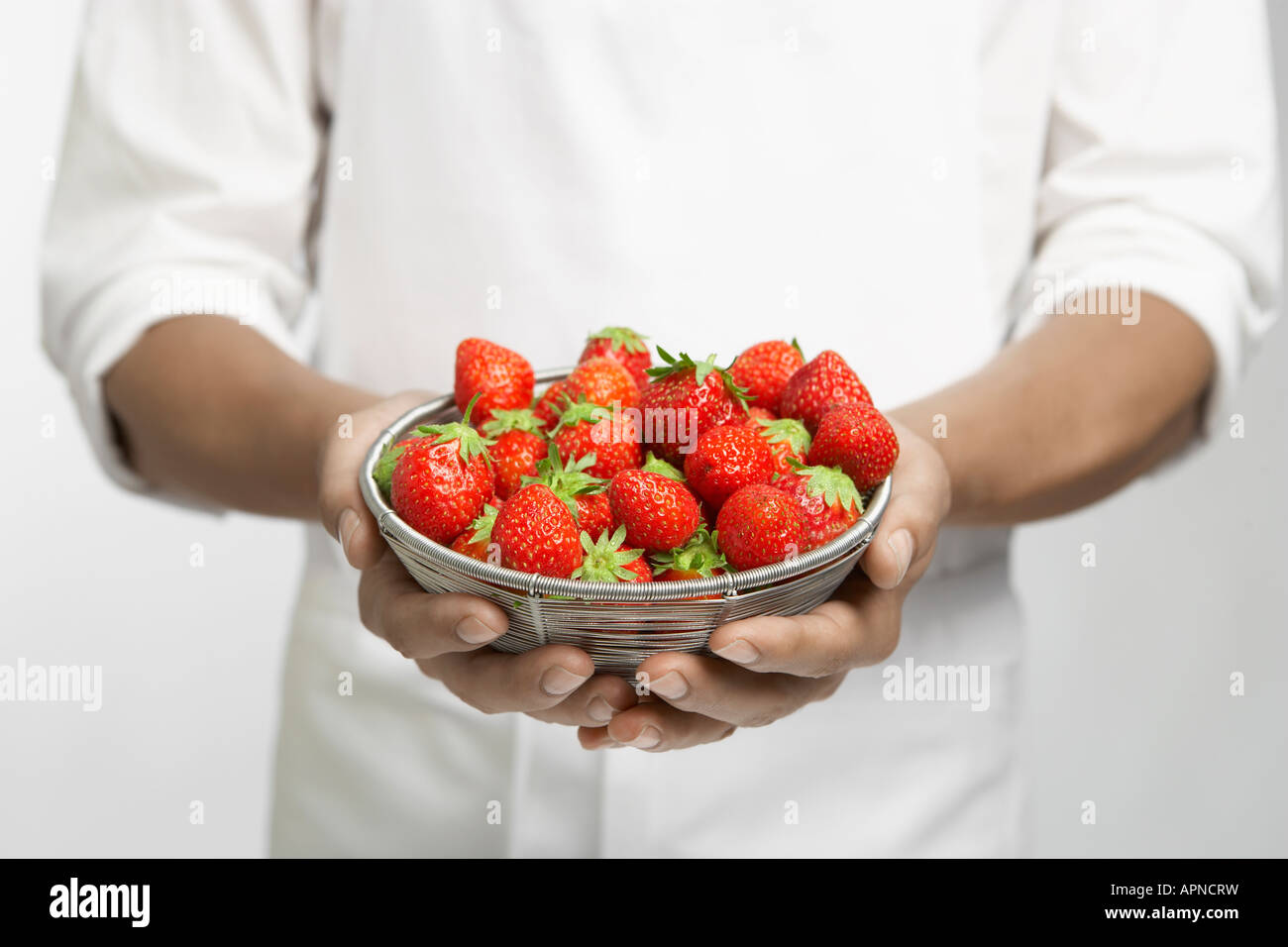 Strawberries in cupped hands hi-res stock photography and images - Alamy