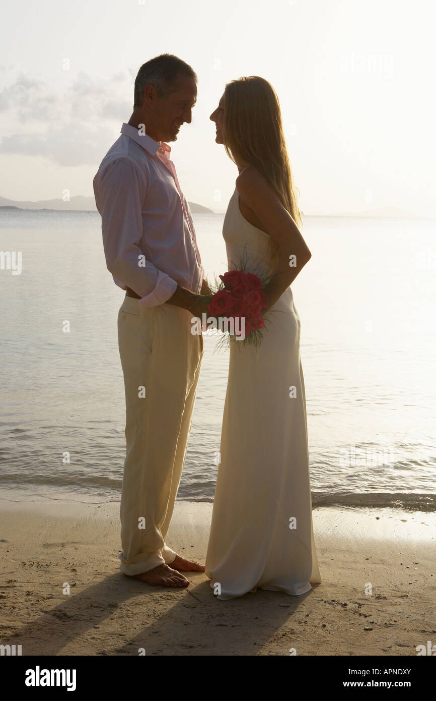 Newlyweds on beach, St. John, US Virgin Islands, USA Stock Photo