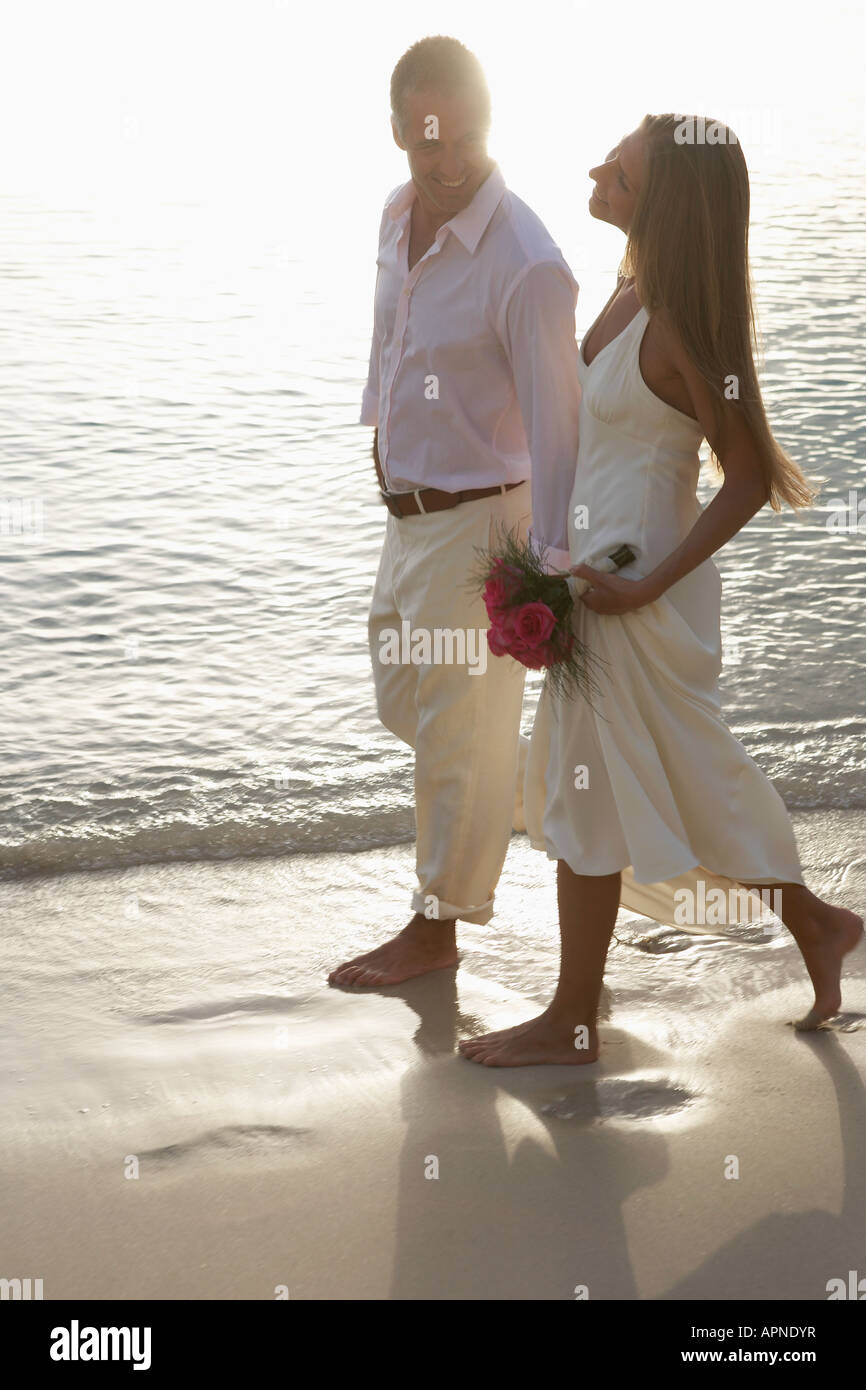 Newlyweds walking on sandy beach, St John, US Virgin Islands, USA Stock Photo