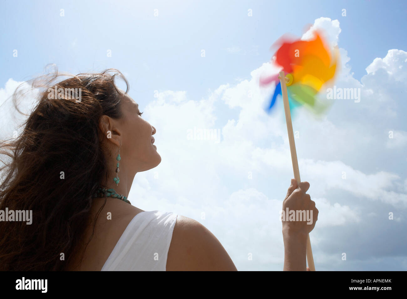 Young woman with pinwheel Stock Photo - Alamy