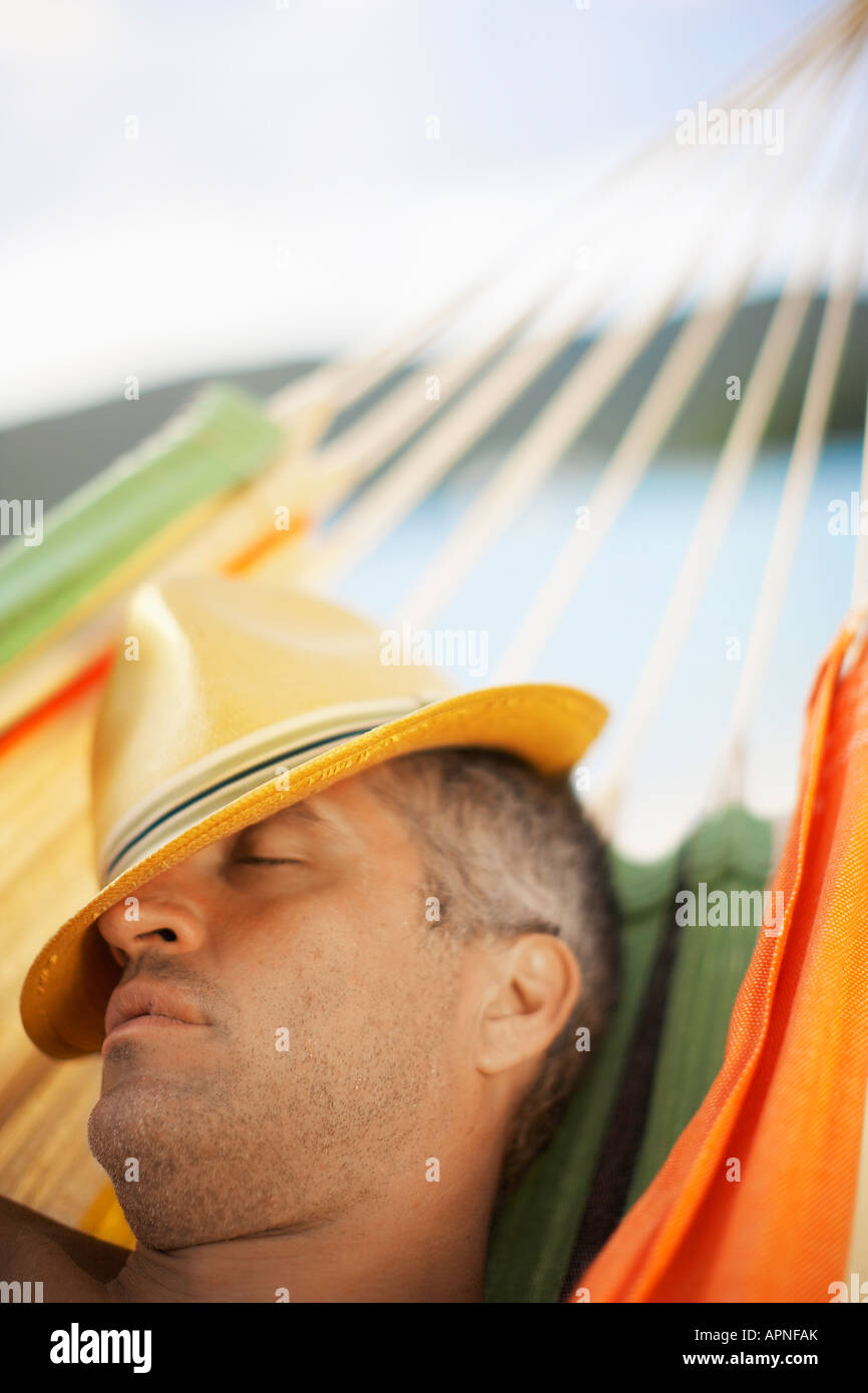 Mid adult man lying in hammock hi-res stock photography and images - Alamy