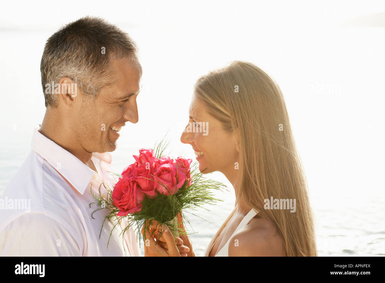 Newlyweds on beach Stock Photo