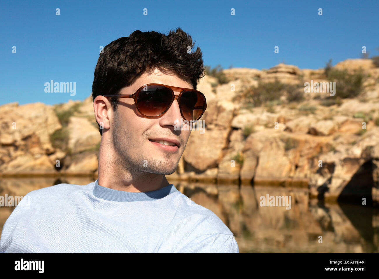 Young man with sunglasses Stock Photo - Alamy