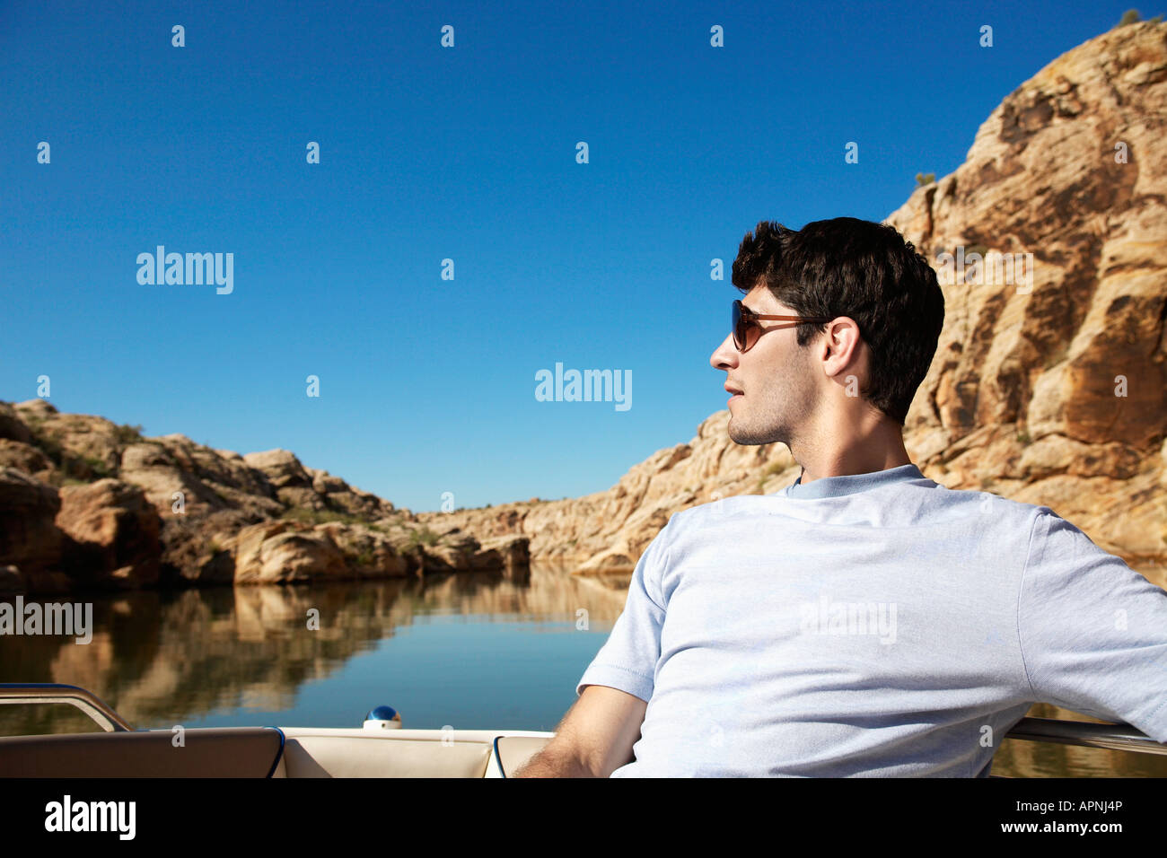 Young man in motorboat hi-res stock photography and images - Alamy