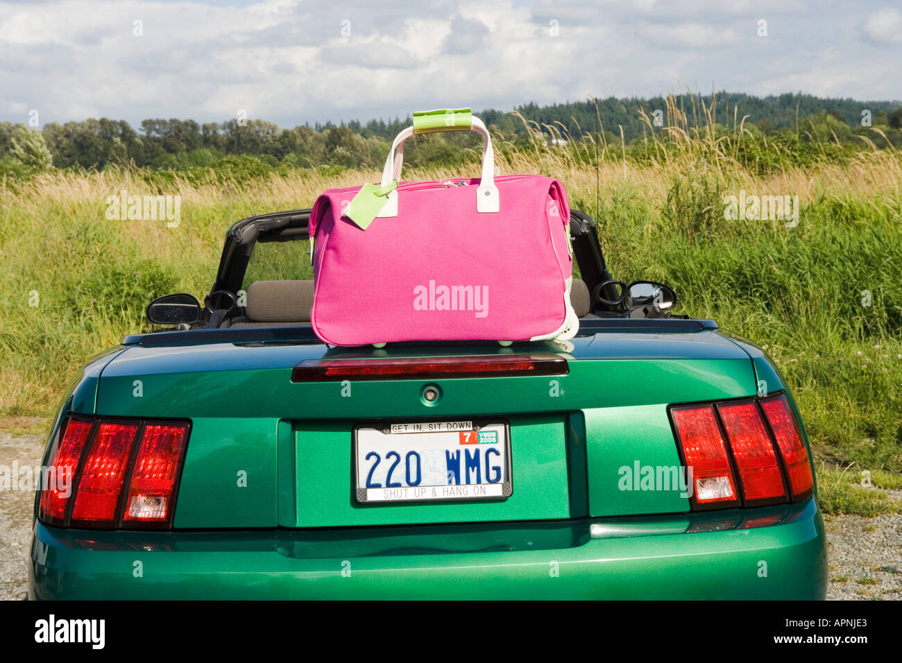 Still life of pink tote bag and car Stock Photo