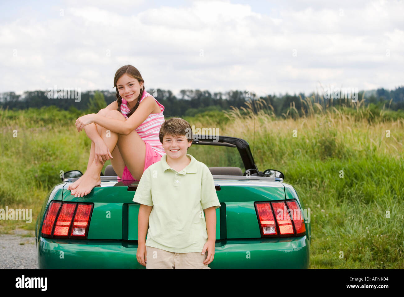 Portrait of a brother and sister outdoors Stock Photo
