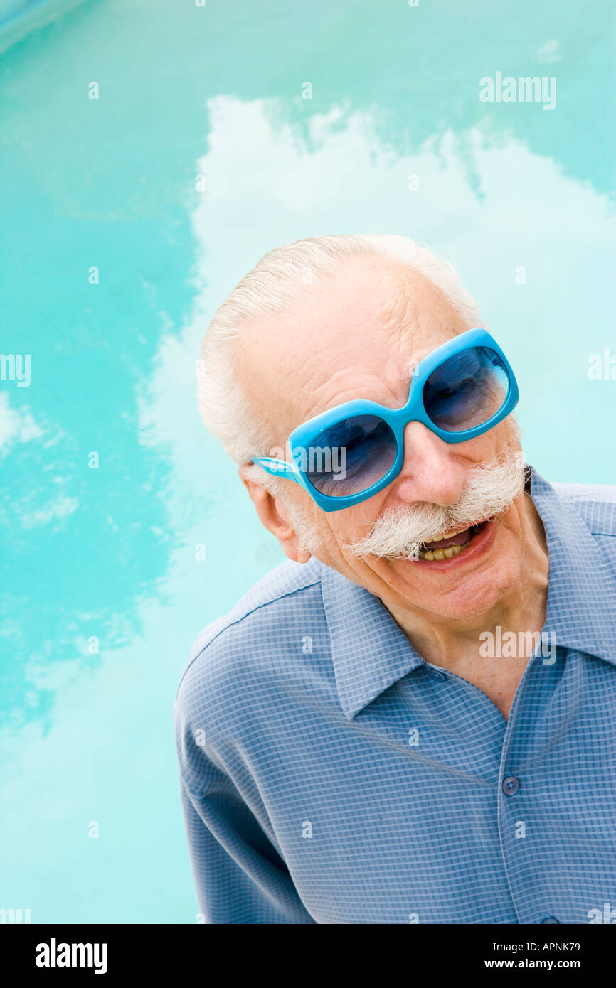 Senior man in wacky sunglasses Stock Photo