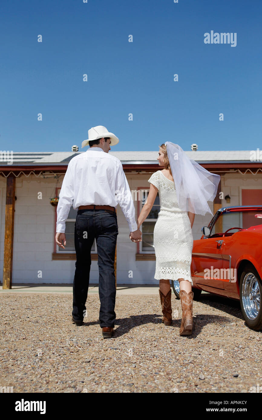 Newlyweds arriving at motel Stock Photo