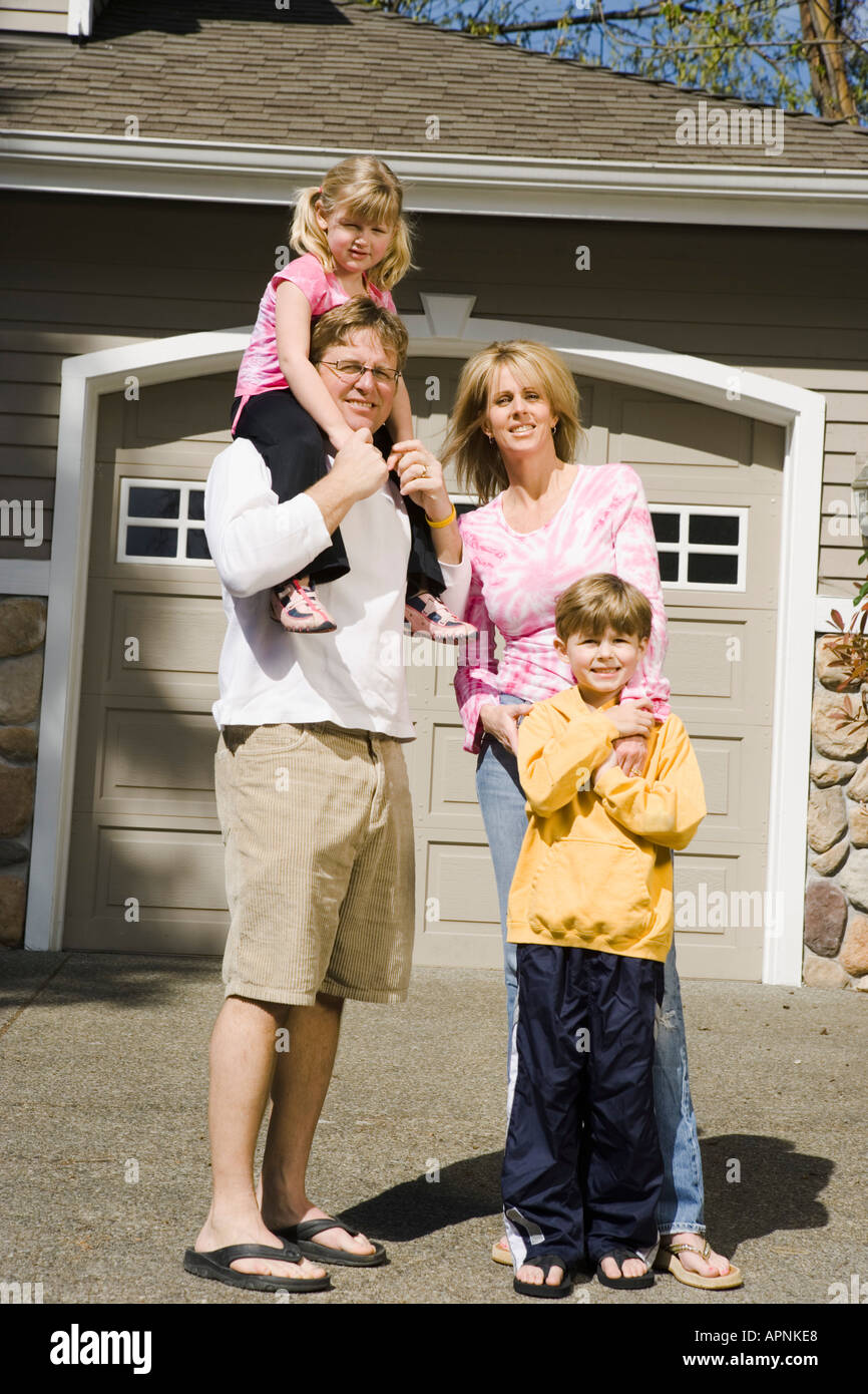 Family portrait outside house Stock Photo - Alamy