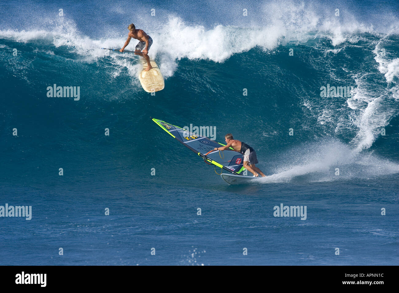 SURFER LAIRD HAMILTON WITH WINDSURFER ROBBY SWIFT IN MAUI Stock Photo