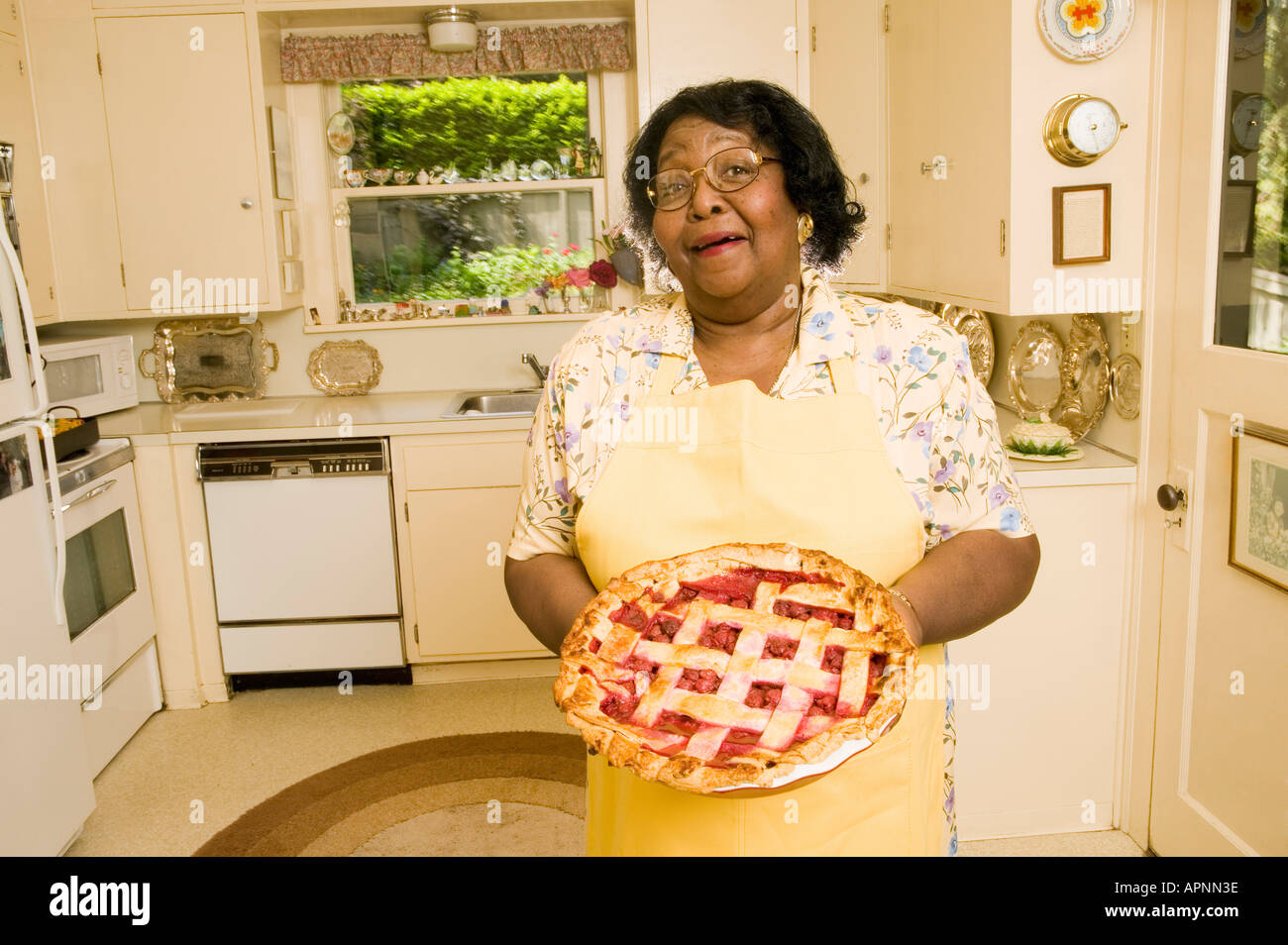 Portrait of woman holding homemade pie Stock Photo