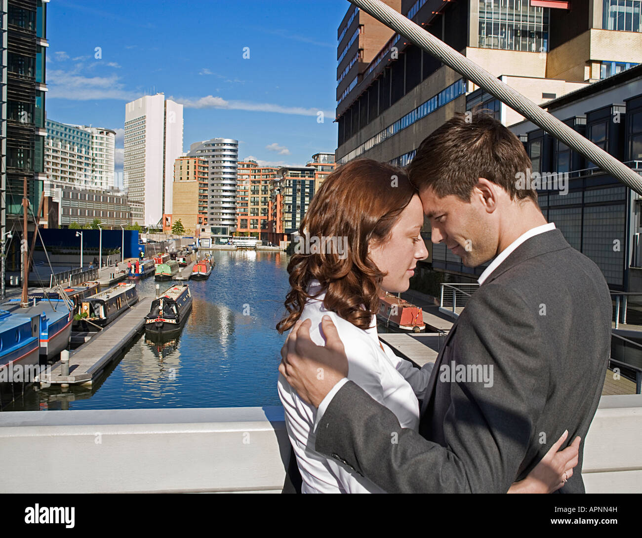 Couple standing face to face on bridge hi-res stock photography and ...