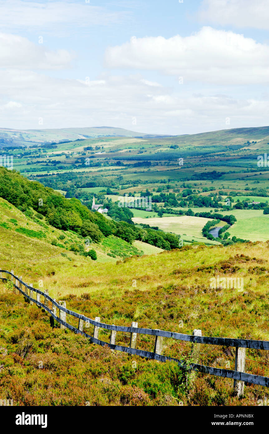 Sperrin Mountains, County Tyrone, Ireland. North over Gortin village in valley of the Owenkillew River east of Newtownstewart. Stock Photo