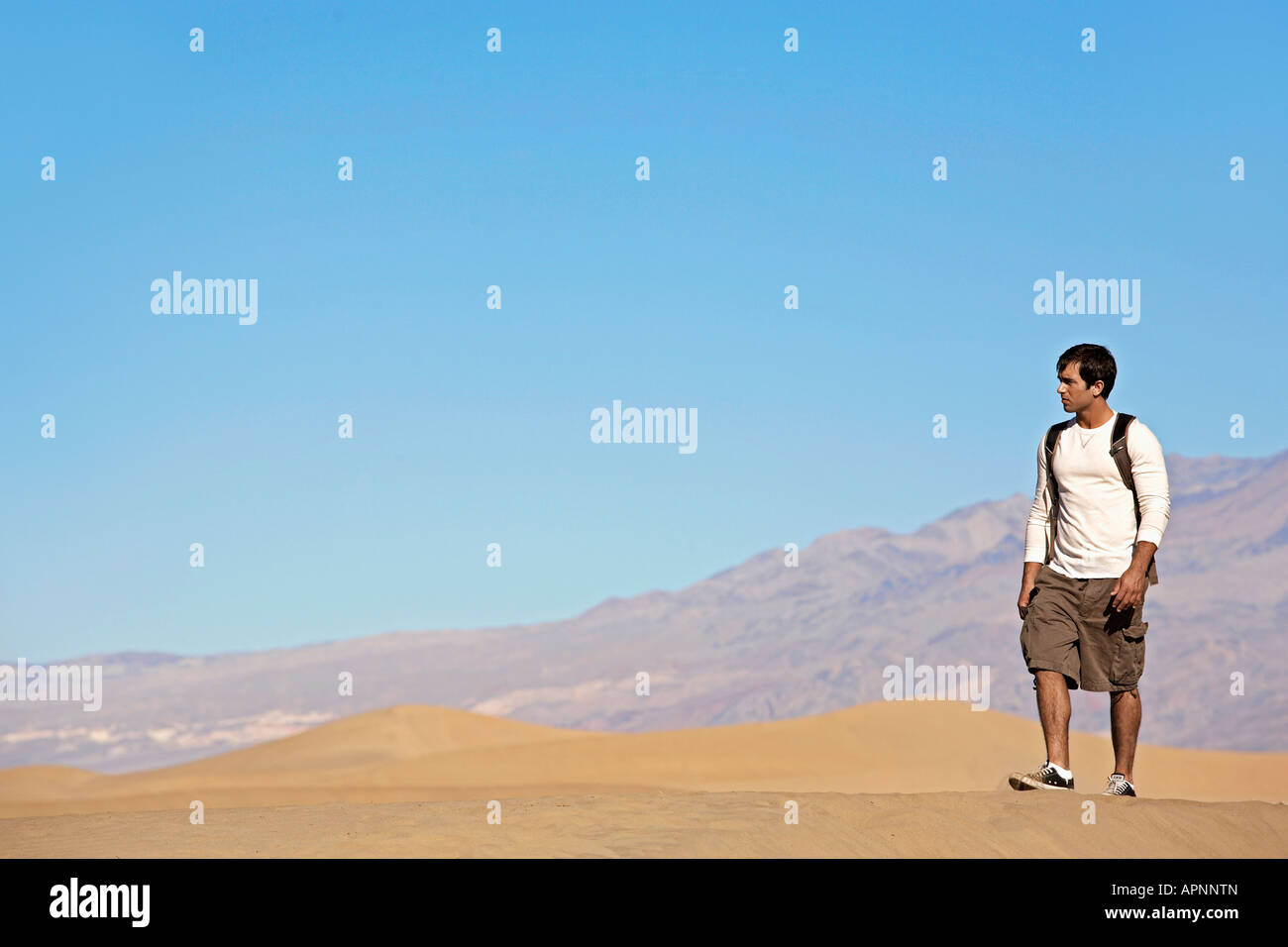 Young Man Hiking in Desert Stock Photo