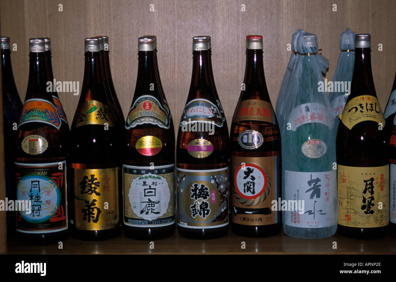 A display of sake bottles, Japan Stock Photo Alamy