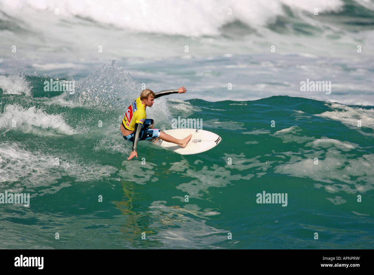 A Surfer riding a wave Stock Photo - Alamy