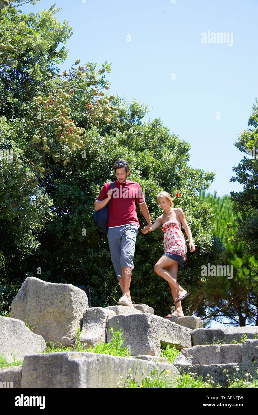 Young couple walking on ruins (low angle view) Stock Photo