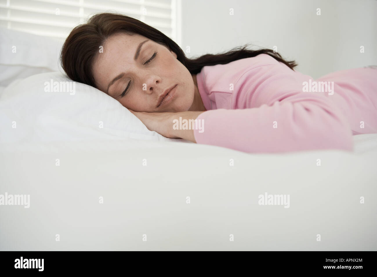Mid adult woman sleeping Stock Photo - Alamy