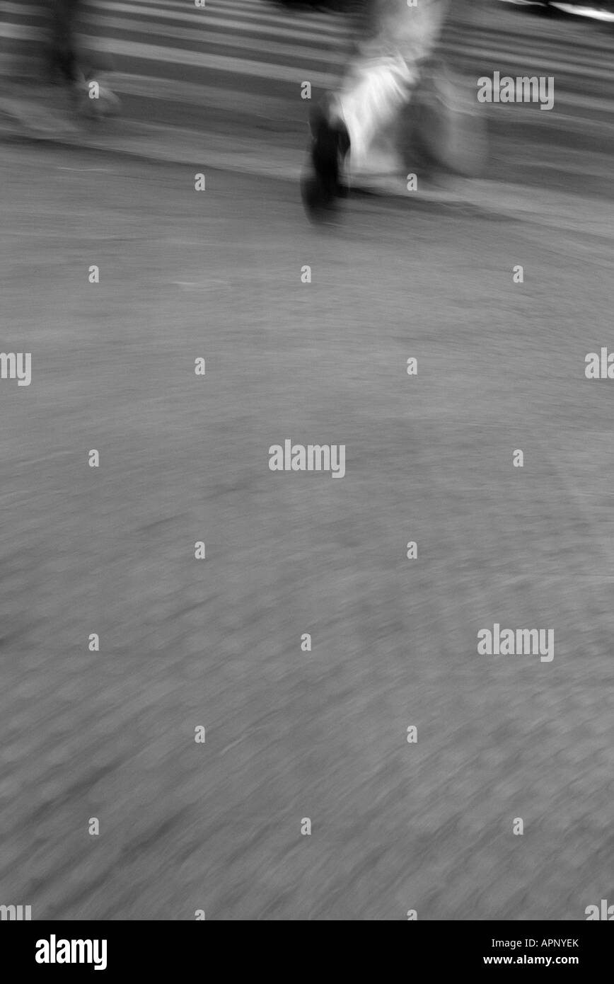 Pedestrian walking on sidewalk Black and White Stock Photos & Images ...