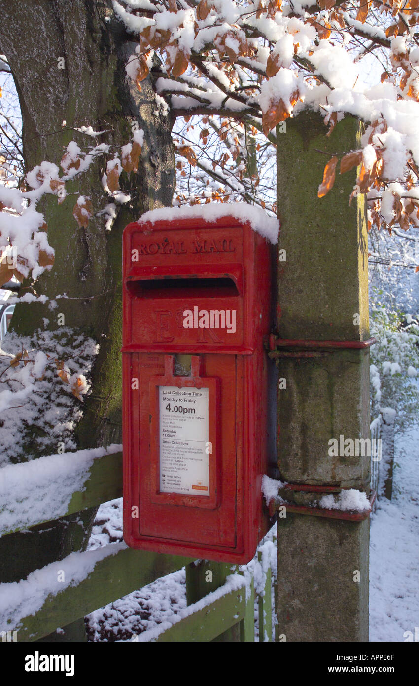 Post Box in the Snow mounted on a post Stock Photo