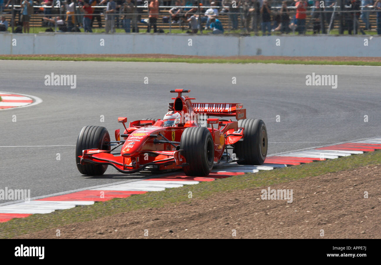 Kimi Raikkonen in his Ferrari Formula One car testing at Silverstone. Stock Photo