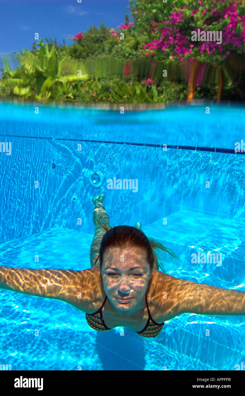 Woman in bikini diving underwater in swimming pool Stock Photo 9052586
