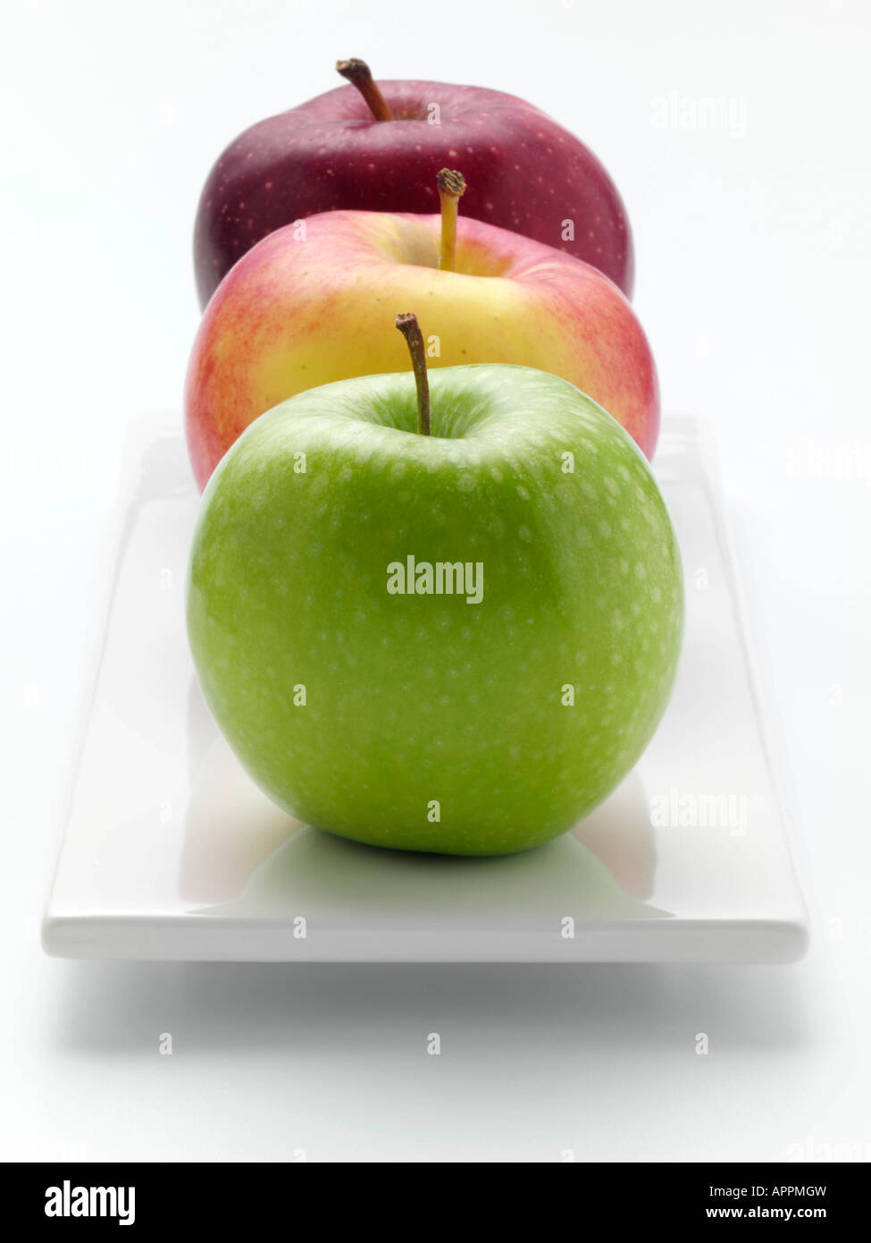 Granny Smith Ambrosia and Red Delicious apple on a white background