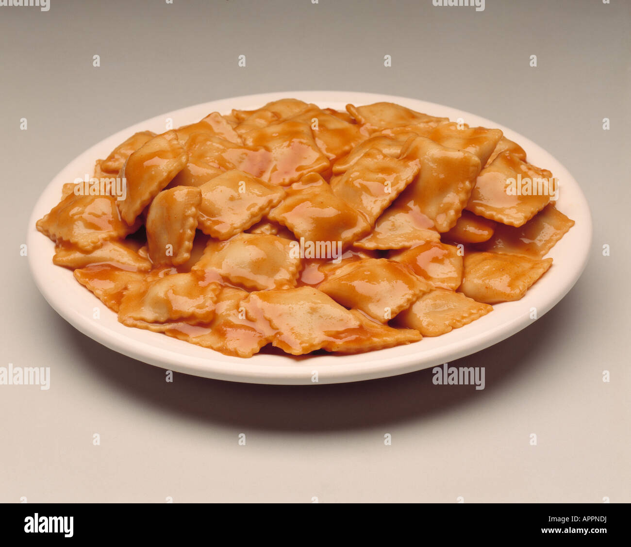 Plate mini raviolis cheese meat sauce Stock Photo - Alamy