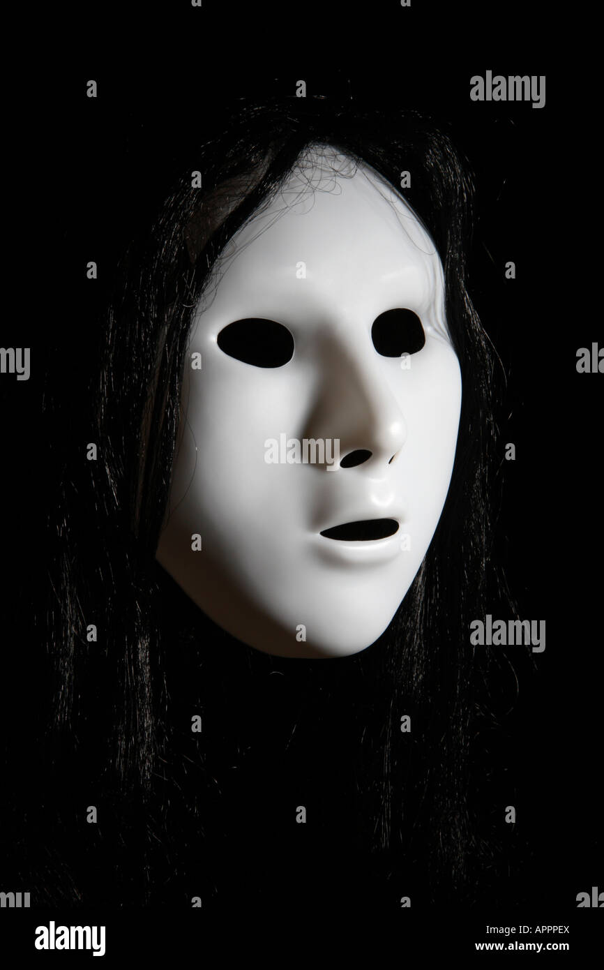 White face in the darkness. Stock Photo
