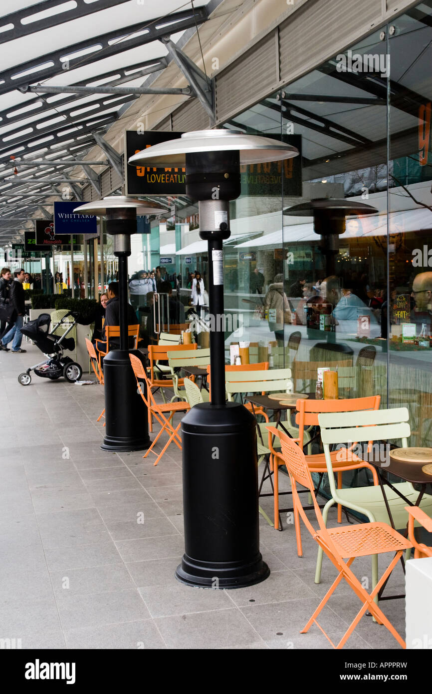 Patio Heaters at Outdoor Tables Brunswick Centre Bloomsbury London United Kingdom Stock Photo
