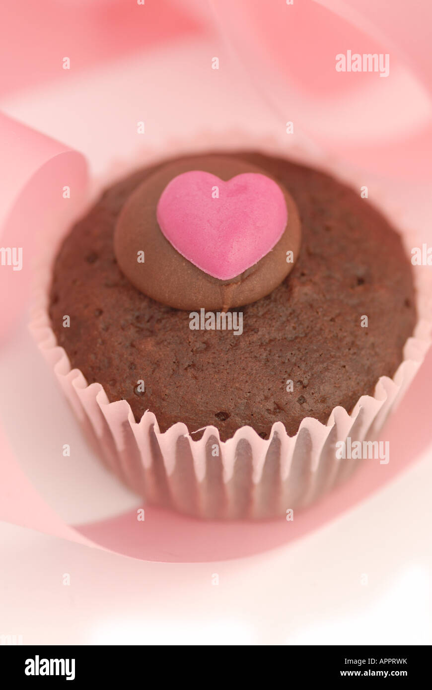 the taste of valentine - bun with heart shaped icing Stock Photo