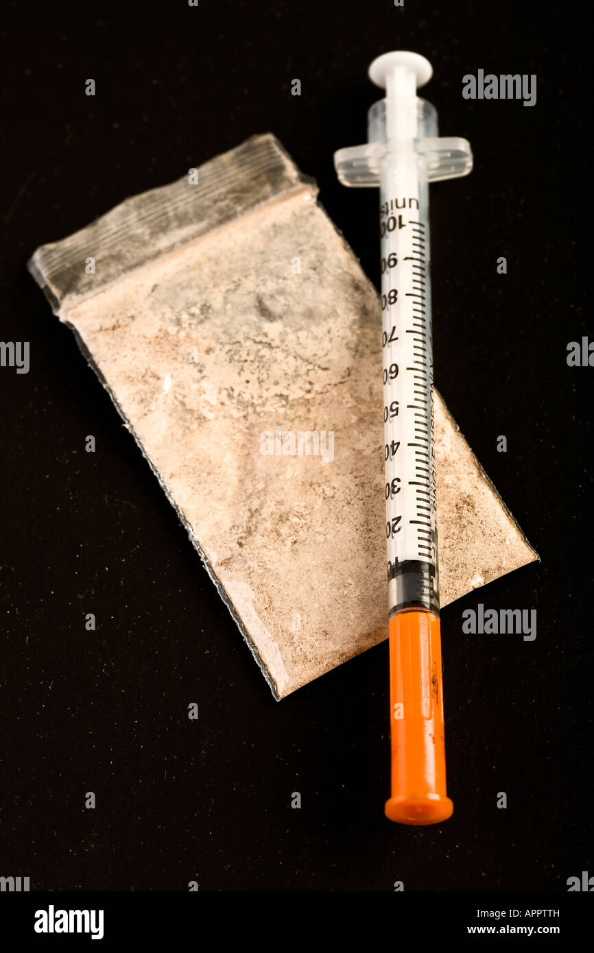 Heroin bag & needle Stock Photo