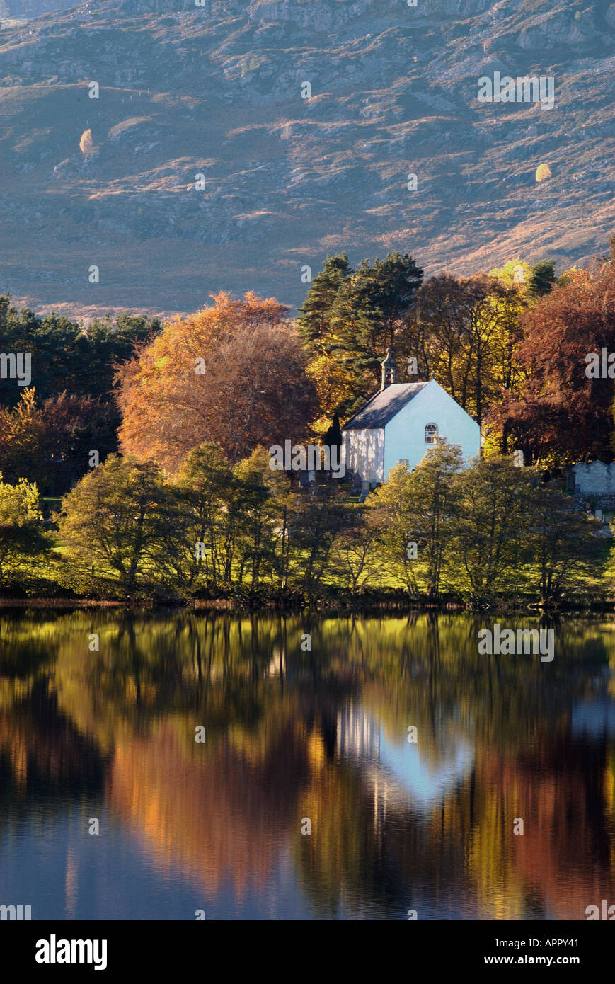 autumnal view of alvie church across loch alvie near kincraig highlands scotland Stock Photo
